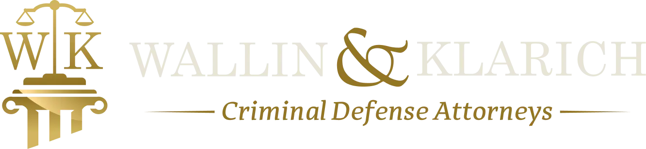 Wallin & Klarich Criminal Defense Attorneys logo with scales of justice symbol